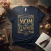 T-shirt design with gold text "I have two titles MOM And TEACHER" in an ornate frame, featuring decorative arrows below