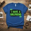 Blue t-shirt with bold green text that reads "I HAVE A GIRLFRIEND" with quotation marks and a black brush stroke