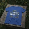 Blue t-shirt with "I HEAR CRICKETS" text surrounded by crickets and a sound wave graphic