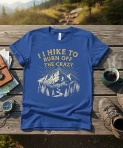 Blue t-shirt with "I Hike To Burn Off The Crazy" text and mountain landscape graphic