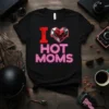 "I HOT MOMS" text with a cracked red 'I' and a stylized geometric heart graphic on a black t-shirt