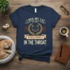 T-shirt with text "I Hug My Cat So I Don't Punch People In The Throat" and a graphic of a