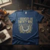 I IDENTIFY AS TWENTY-BINE text with vintage steampunk clock and laurel wreath graphic on a navy blue t-shirt