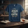 I J Kve Jesus And Katie Christian faith quote on a navy blue t-shirt with gold distressed lettering and laurel