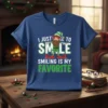 Christmas elf graphic with text "I Just Came To Smile Smiling Is My Favorite" on a navy blue t-shirt