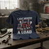 I Just Dropped A Load trucker t-shirt featuring a red semi-truck graphic and distressed white text