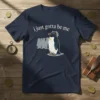 Navy t-shirt with white text "i just gotta be me" above a cartoon rockhopper penguin standing with other penguins in