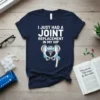 I JUST HAD A JOINT REPLACEMENT IN MY HIP text with an anatomical hip graphic on a navy blue t-shirt