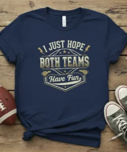 I Just Hope Both Teams Have Fun text design on a navy blue t-shirt with graphic elements like whistles and