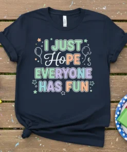 I JUST Hope EVERYONE HAS FUN quote on a navy t-shirt with colorful pastel text and balloon graphics