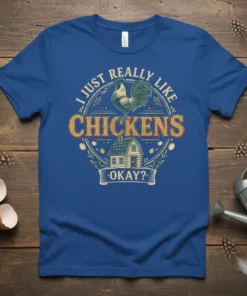 T-shirt design with text "I Just Really Like Chickens. Okay?" featuring a rooster, barn, and eggs in a circular emblem