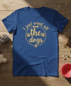 I just want all the dogs quote with paw prints and bone graphic on a blue t-shirt