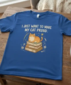 White text reads "I JUST WANT TO MAKE MY CAT PROUD" above a cute cat sitting on books with stars