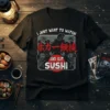 Black t-shirt with "I Just Want To Watch And Eat Sushi" design, featuring Japanese characters, spooky skeletons, and sushi graphic
