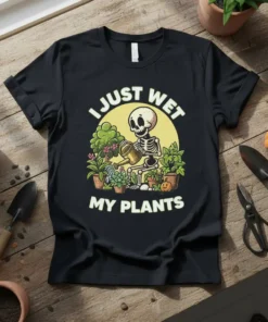 Black t-shirt with "I Just Wet My Plants" text and a cartoon skeleton watering plants in pots