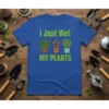 I Just Wet MY PLANTS text with three potted plants illustration on a blue t-shirt