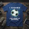 I Kicked 100 Days of School text with a soccer ball graphic on a blue t-shirt, designed for students