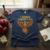 Navy blue t-shirt with "I Kicked Cancer's Ass" text above a golden phoenix graphic
