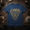 Blue t-shirt with "I KNOW" text above a golden griffin illustration with spread wings