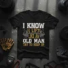Black t-shirt with white and gold text "I Know I Lift Like An Old Man Try To Keep Up" and