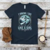 T-shirt design with text "I Know I Ski Like A Girl Try To Keep Up" and a female skier graphic