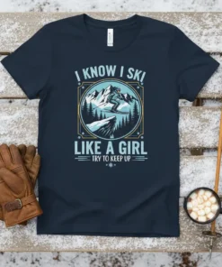 T-shirt design with text "I Know I Ski Like A Girl Try To Keep Up" and a female skier graphic