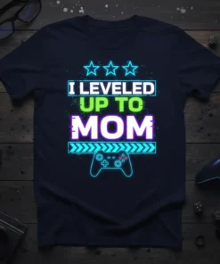 I Leveled Up To Mom text design with neon glow, stars, and a video game controller graphic