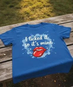 Blue t-shirt with white text "I licked it so it's mine" and a red graphic of lips and tongue, surrounded