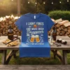 Blue t-shirt with "I Light Fires And Make Beer Disappear What's Your Super Power?" text, campfire, and beer mugs graphic
