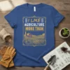 I Like Agriculture More Than text with farm landscape, barn, and tractor graphic on a blue t-shirt