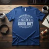 White text on a blue t-shirt reads "I LIKE BEING CALLED CALLED A GOOD BOY" in a decorative font, ideal