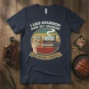 I Like Bourbon And My Smoker And Maybe 3 People quote on a navy t-shirt, featuring a hand holding a