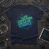 T-shirt with neon text "I Like Computers And Maybe 3 People" in a geometric frame, navy blue background