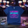 T-shirt with neon text "I Like Dogs and Sharks and Maybe 3 People" featuring shark graphics and paw prints