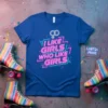 Blue t-shirt with neon-style text "I Like Girls Who Like Girls" and LGBTQ+ symbols, designed for pride celebrations