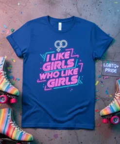 Blue t-shirt with neon-style text "I Like Girls Who Like Girls" and LGBTQ+ symbols, designed for pride celebrations
