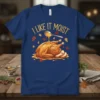 I Like It Moist funny Thanksgiving turkey t-shirt design with gravy pouring over a whole roasted chicken and autumn leaves