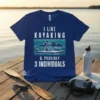 I Like Kayaking & Possibly 3 Individuals quote on a blue t-shirt with a graphic of a kayaker on a