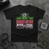 I Like Music That Sounds Like Shit text with crossed-out cassette tapes graphic on black t-shirt