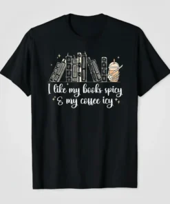 I like my books spicy & my coffee icy quote on a black t-shirt with a stack of books and