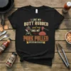 Black t-shirt with the text "I Like My Butt Rubbed and My Pork Pulled Certified BBQ Pitmaster" in vintage style