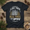 I Like Them Real Thick And Sprucy text with Christmas tree graphic on a black t-shirt
