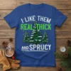 I Like Them Real Thick And Sprucy funny Christmas t-shirt with snow-covered pine trees and holiday text