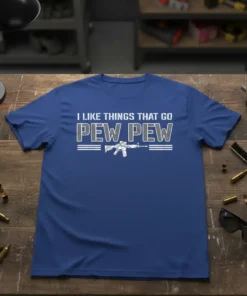 Blue t-shirt with white text "I LIKE THINGS THAT GO PEW PEW" and a graphic of a rifle