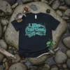 Black t-shirt with "i like turtles." text and two sea turtles swimming in a turquoise wavy circle graphic