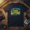 I Like To Push Push Buttons text design with retro gaming circuit board graphics and red button on black t-shirt