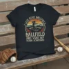 T-shirt with text "I Live At The Ballfield Ballfield And Visit My House Sometimes" and baseball player graphic