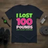 T-shirt with bold text "I LOST 100 POUNDS AND I'M NOT STOPPING" in vibrant colors, celebrating weight loss achievement