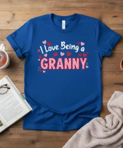 Blue t-shirt with "I Love Being a GRANNY" text in white and pink, surrounded by small hearts