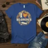 I Love Blondes text with a heart graphic and retro sunburst design on a blue t-shirt